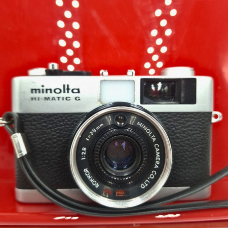 Aparate foto SLR (pe film) (SH) - Minolta Hi-Matic G – Cameră analog 35mm cu expunere automată și obiectiv Rokkor 38mm f/2.8, fabricată în Japonia