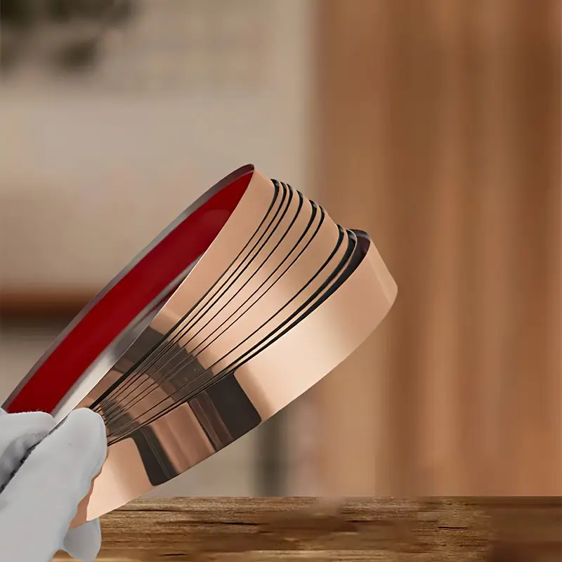 Bandă decorativă autoadezivă rose gold – 500 cm, din oțel inoxidabil cu adeziv 3M – finisaj lucios pentru mobilă, pereți și decorațiuni interioare. [18]