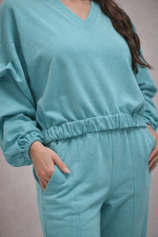 Set dama turcoaz elegant cu pantaloni evazati si slit frontal – vedere completa [1]