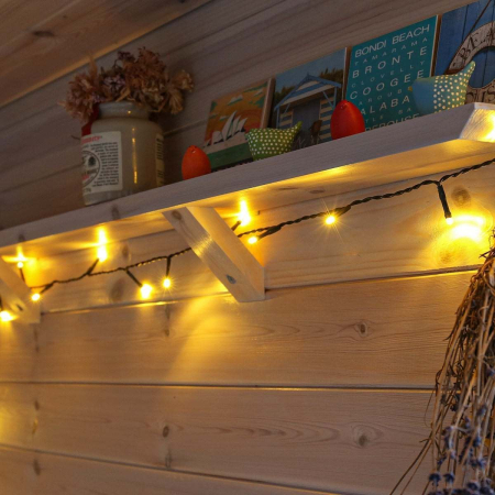 Instalatie de Craciun liniara Yoto, 10 m, din care 1 m cablu priza 220V, 100 LED, 8 jocuri de lumini, controler, fir negru, alb cald [7]