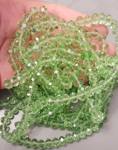 Margele sticla si cristal - Margele de sticla, rondele fatetate, cristale verde deschis - 6x4 mm - 1 bucata