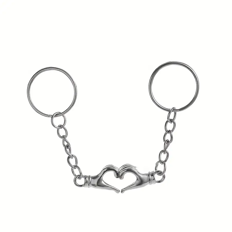 Set brelocuri cu magneți – două palme care se atrag și formează o inimă [1]