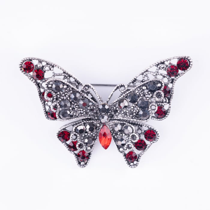 Brosa metalica argintie fluture cu pietricele rosii rubinii si doua randuri de aripi argintie imagine noua 2022