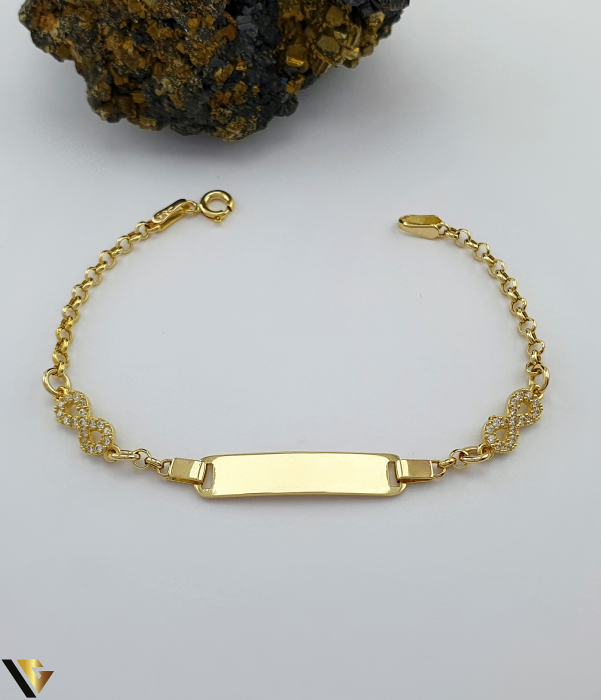 Bratara Aur 14k, Pentru Copii Cristale de zirconiu Greutate: 3.15 gr Dimensiune placuta: 25 mm / 6 mm Lungime: 15 cm Latime: 2.8 mm Marcaj / titlu: "585" Locatie: Bacau Calea Marasesti Tel: 0756943079 [1]