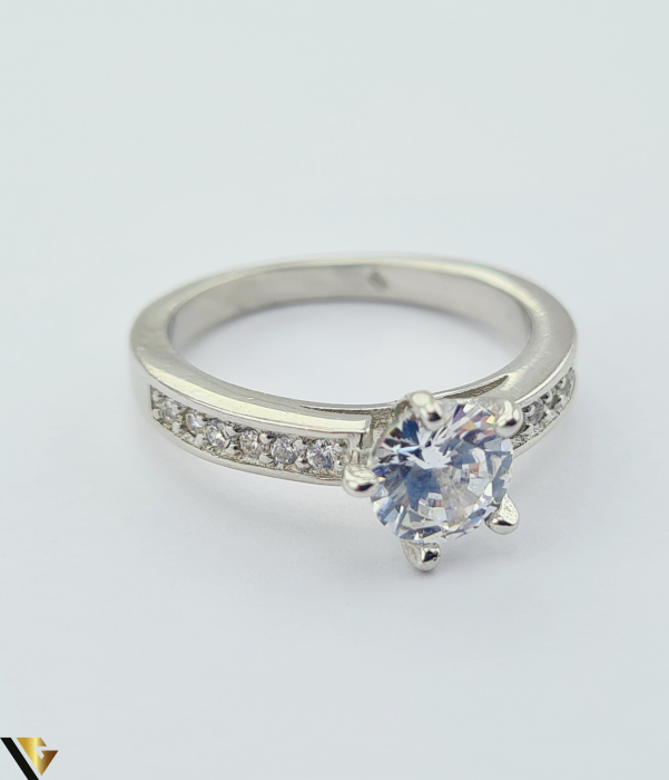Inel din argint, 925 3.43 grame Latime inel 7mm Diametrul inelului este de 17.2mm (masura standard RO:54 si UE: 17) Cristale de zirconiu Marcaj cu titlul "925" Locatie HARLAU [2]