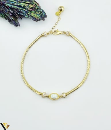 Bratari din aur - Bratara aur 14k, opal de sinteza si cubic zirconia Greutate: 3.96 grame Latime: 2.15 mm  Dimensiune opal de sinteza: 8 mm / 6 mm Lungime: 20.5 cm (posibilitate prindere de la 17 cm)  Marcaj / titlu: " 585 "