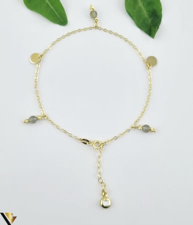 Bratari din aur - Bratara aur 14k, cubic zirconia si zultanit Greutate: 2.40 grame Diametru zultanit: 4.30 mm Proprietati zultanit: isi schimba culoarea in diferite surse de lumina de la verde-kiwi la roz purpuriu Latime za: 1.30 mm  Lungime: 22 cm (posibilitate prindere de la 18 cm) Marcaj / titlu: 585  Locatie: HARLAU Tel: 0723353111