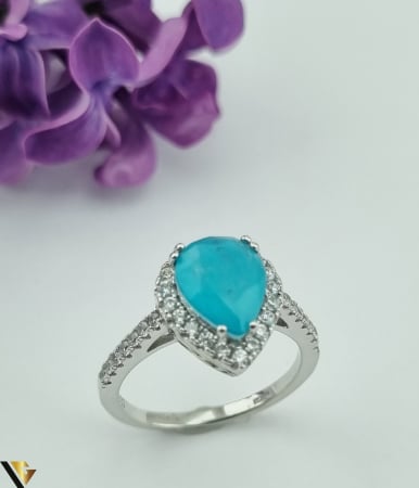 Inele din argint - Inel din argint, 925 3.72 grame Piatra Paraiba, avand dimensiuni de 8 mm / 10 mm Stralucire deosebita, cu nuante de turcoaz neon Anturaj cu cristale de zirconiu Diametrul inelului este de 18.3 mm, masura UE:17.50, masura standard RO:57.50 (circumferinta) Latime maxima 12 mm Produs Nou Marcaj cu titlul "925" Locatie HARLAU  * * * * * * * * * * * * *