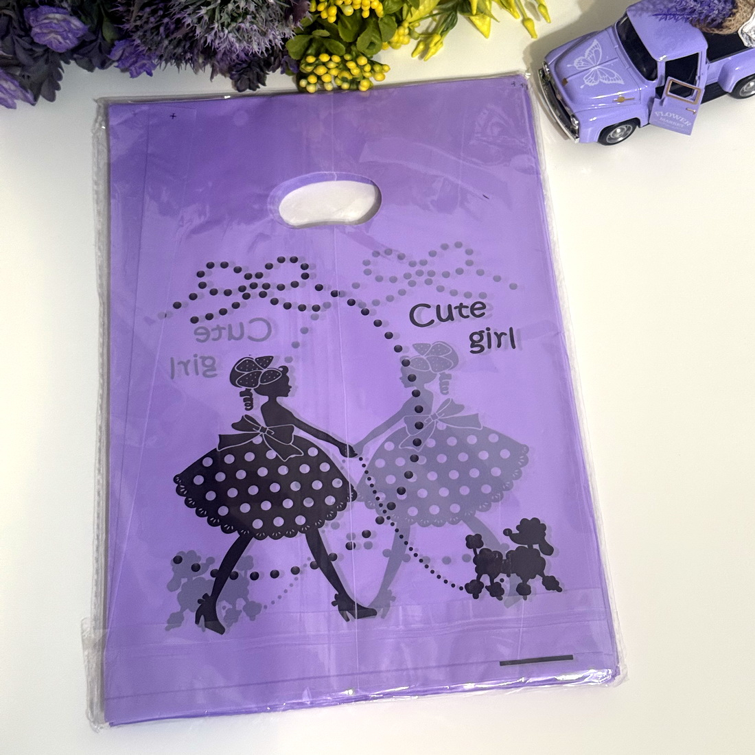 Set 100 pungi din plastic mov imprimeu fata cu catel 24cm x 20cm [2]