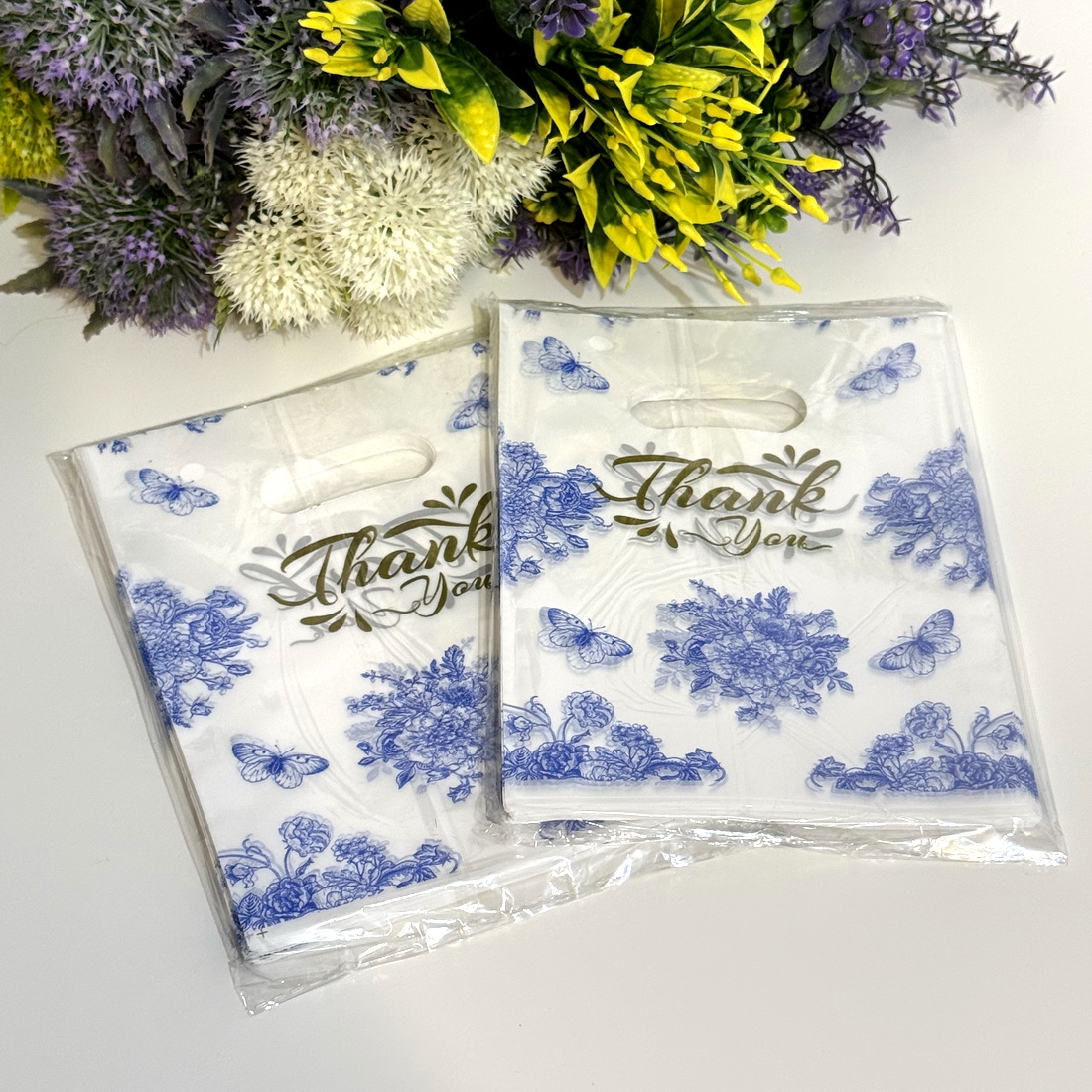 Set 100 pungi din plastic imprimeu albastru flori si fluturi 20cm x 15cm [3]