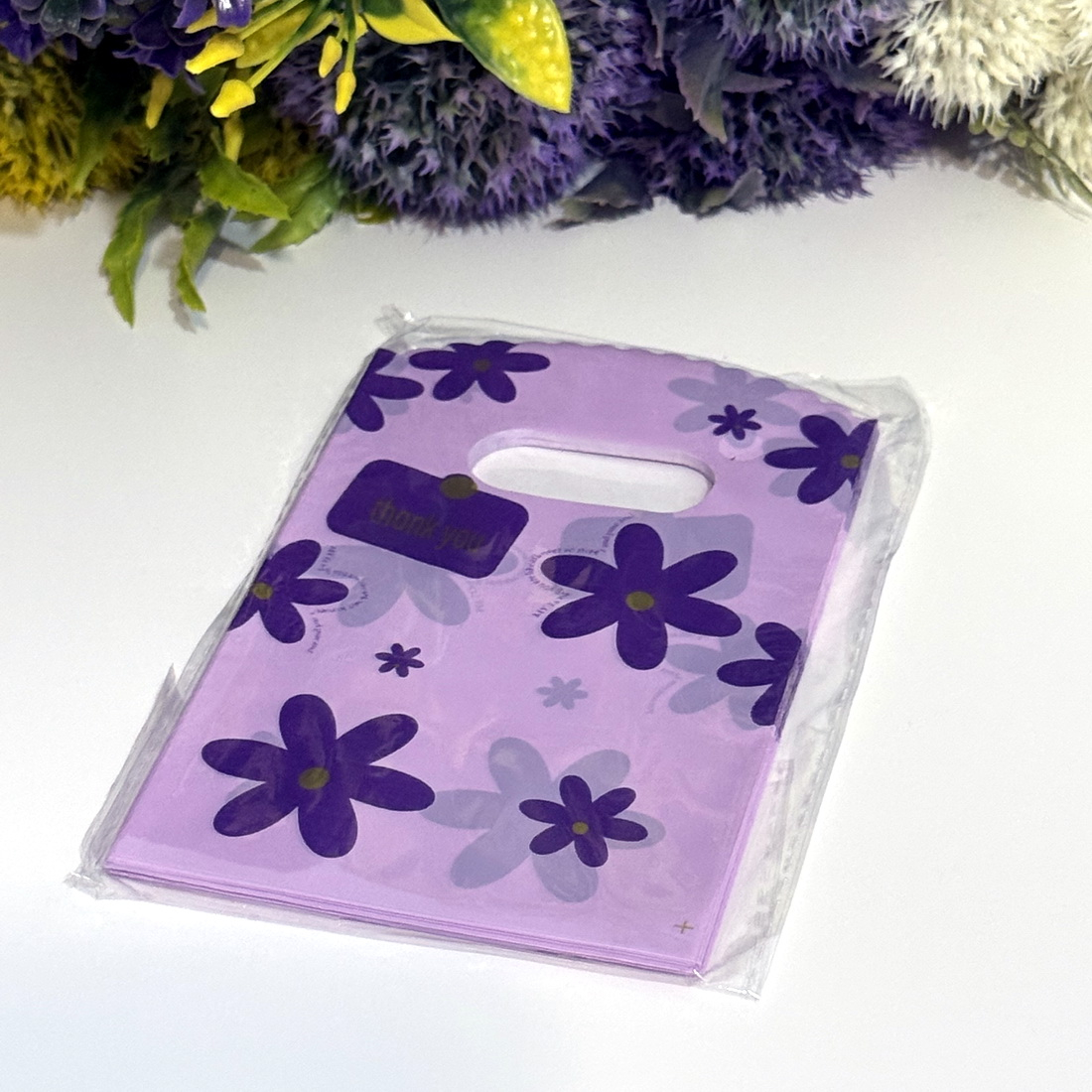 Set 100 pungi plastic mov imprimeu flori mov 15cm x 9cm [3]