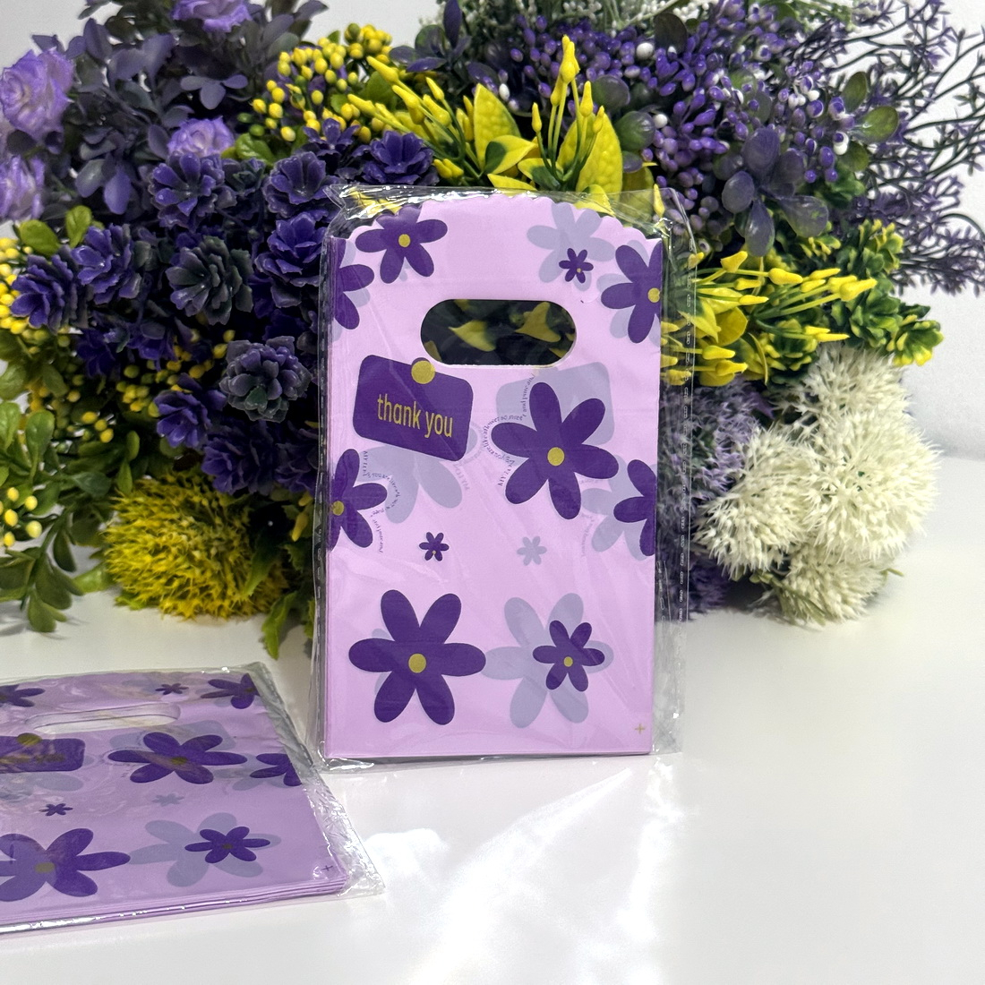 Set 100 pungi plastic mov imprimeu flori mov 15cm x 9cm [2]