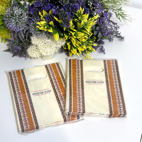 Set 100 pungi din plastic galbene imprimeu maro 20cm x 15cm [2]