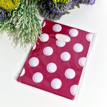 Set 100 pungi din plastic magenta cu buline albe 20cm x 15cm