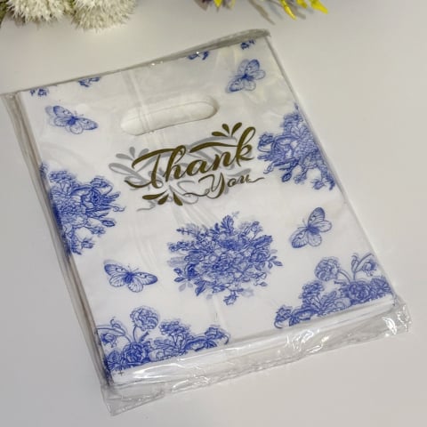 Pungi pentru cadouri - Set 100 pungi din plastic imprimeu albastru flori si fluturi 20cm x 15cm