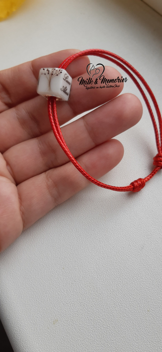 Charm tip cub, cu baza din argint,,ce contine lapte matern, suvita bebelusului si bucati din cordonul ombilical [6]