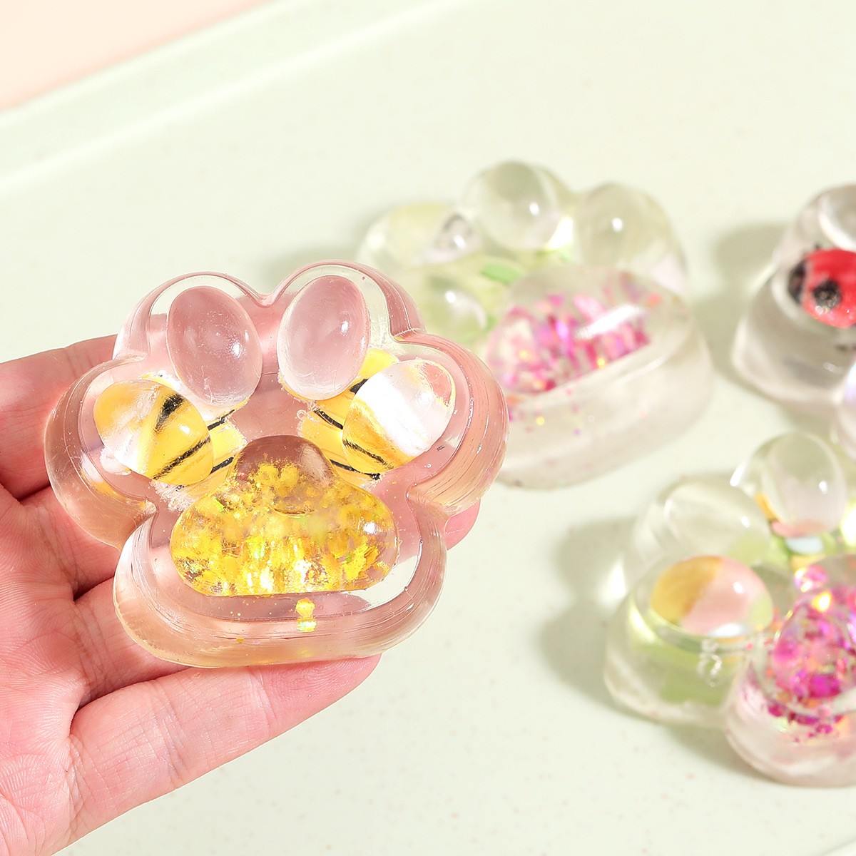 Jucarie Antistres Squishy, Flippy, cu Revenire Lenta, Squeeze Pinch Family, Model Cat Paw, 6.5 x 7 cm, din Tpr, 4-6 Ani, Model 7 Insecte, Transparent [8]