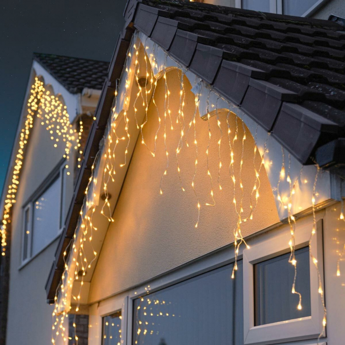 Instalatie Craciun Yoto, Tip Franjuri/Turturi, 12 m, 300 LED-uri, Prelungitor 1.5 m, 8 Jocuri de Lumini, Interconectabila, Conectare la Retea, Fir transparent, Interior/Exterior, Alb Cald [1]