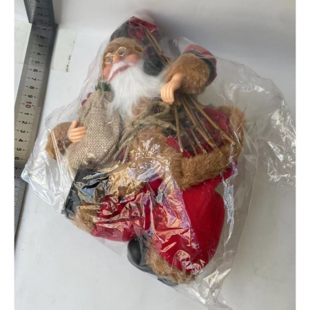 Figurina Decorativa Craciun, Flippy, Mos Craciun Asezat cu Surcele la Brat, 35 x 18 x 20 cm, Material Plastic+Textil, Interior/Exterior, Rosu/Maro [5]