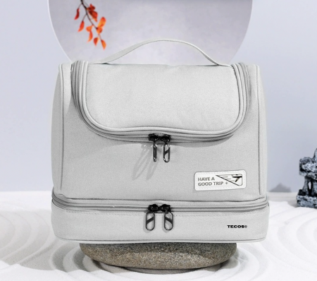 Organizatoare bagaje - Geanta textila de voiaj unisex pentru depozitare si transport articole cosmetice, Tecos®, dimensiuni 25* 11* 20 centimetri, cu agatatoare, gri