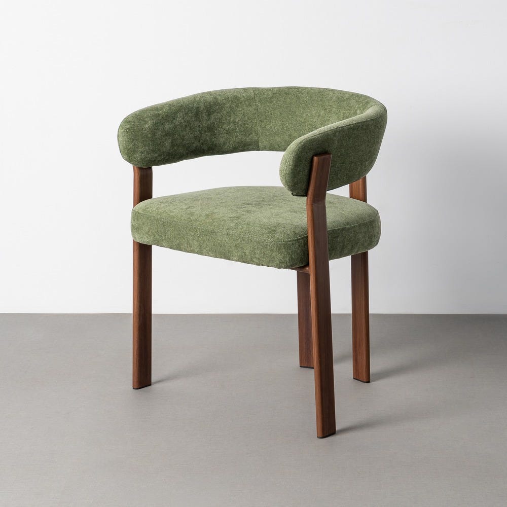 Stil de design - Scaun tapițat verde din stofă bouclé cu spătar semicircular și brațe joase pe picioare din oțel