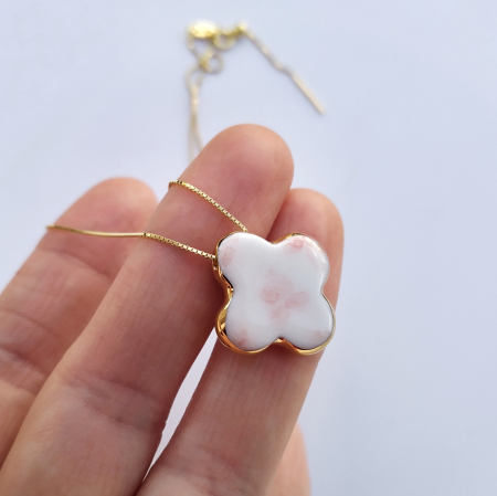 White porcelain cross pendant with flowers