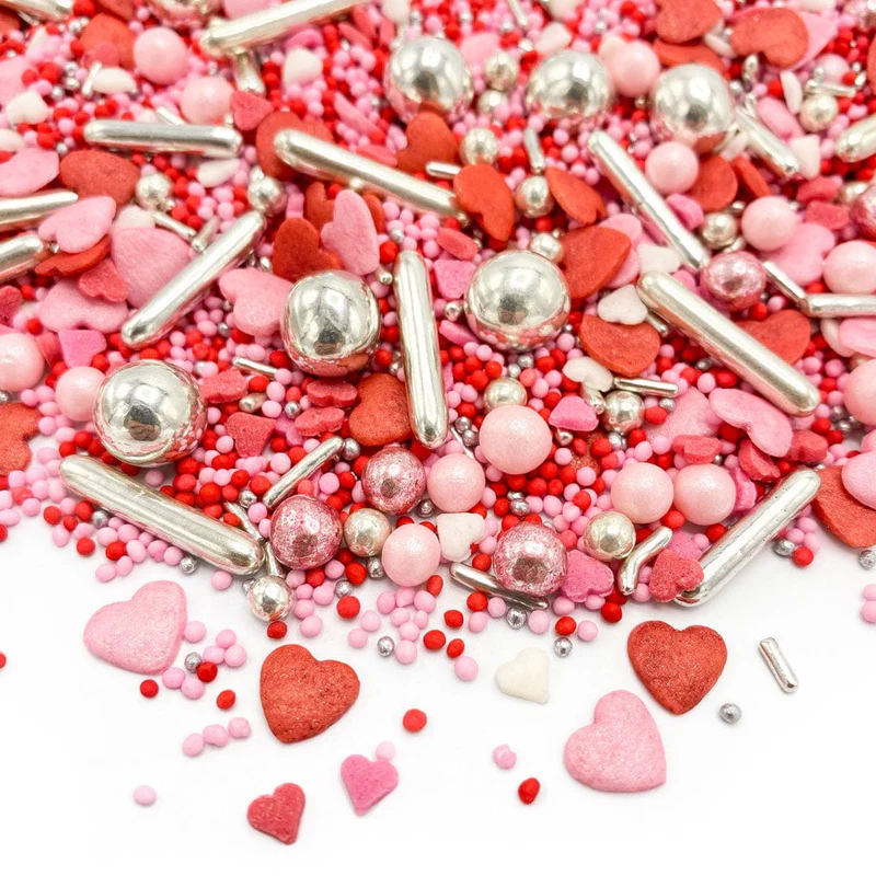 Mix Sprinkles din zahar colorate pentru decorarea produselor de cofetarie si patiserie. Inimioare mici roz si rosii, bilute mici roz si rosii, bilute mari si bastonase argintii din zahar, ideale pentru Valentines Day si 8 Martie. [0]