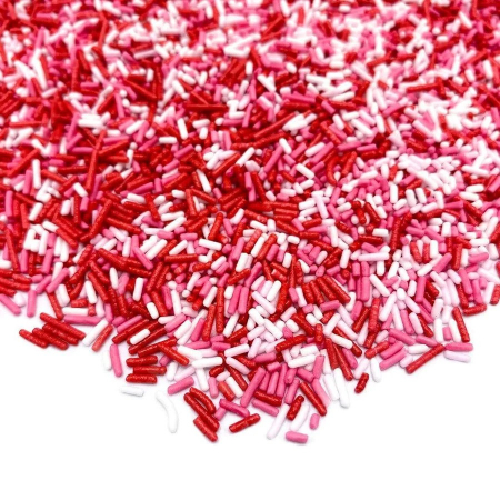 Mix Sprinkles din zahar colorate pentru decorarea produselor de cofetarie si patiserie. Bastonase subtiri de zahar in culori specifice de Valentines Day sau 8 Martie roz, rosu si alb. [1]