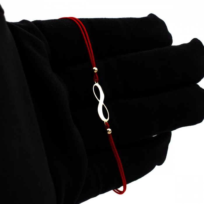 Brățară cu simbol infinit din aur 14K pe șnur roșu – model unisex elegant [3]