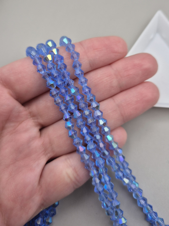 Margele - Margele biconice 4mm albastru indigo AB