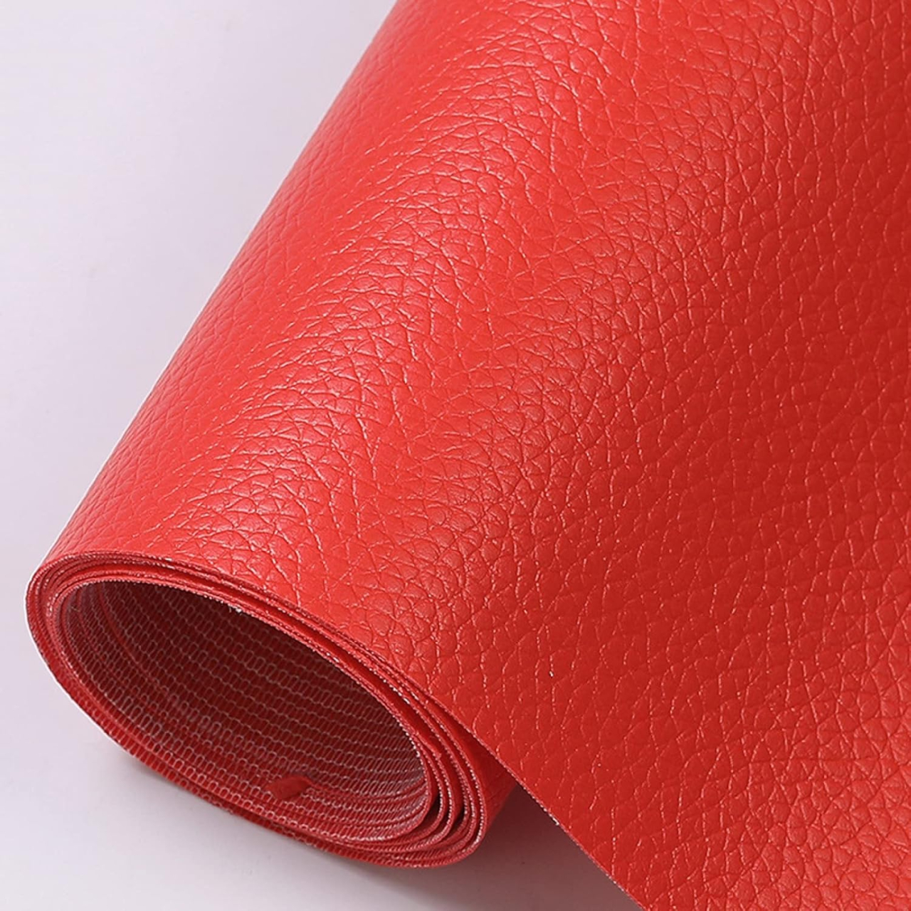 Folie din piele ecologică autoadezivă Luxer, Red, dimensiune 137x60 cm, ideală pentru recondiționare canapea, scaun sau interior auto. [1]