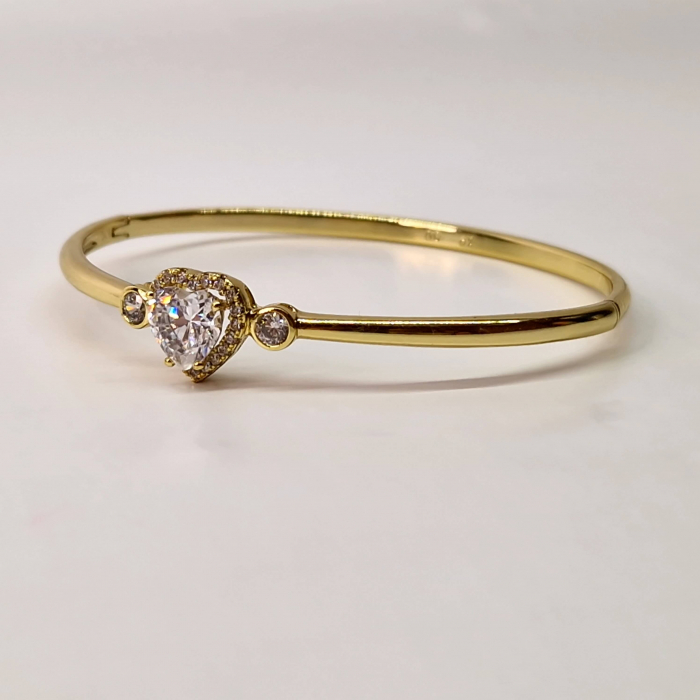 Bratara dama placata cu aur galben de 14K impodobita cu un cristal central in forma de inima din zirconiu transparent [3]