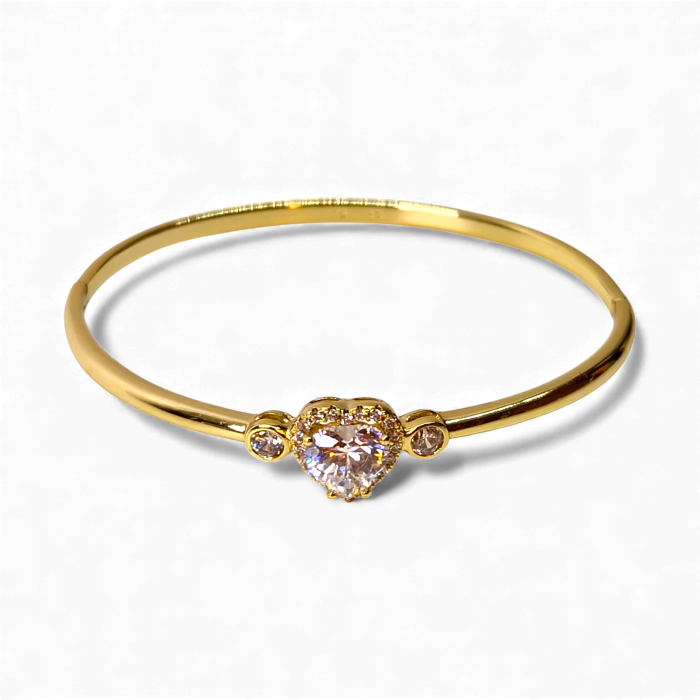 Bratara dama placata cu aur galben de 14K impodobita cu un cristal central in forma de inima din zirconiu transparent [7]