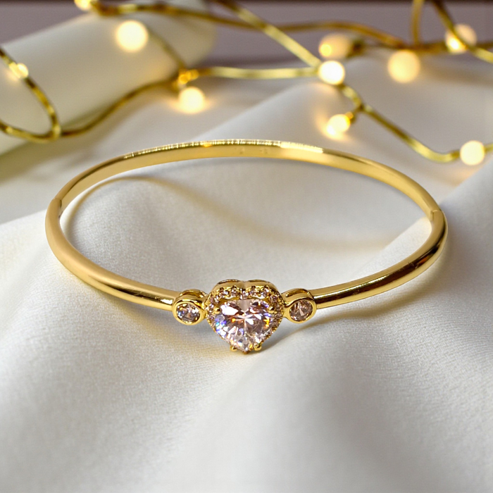 Bratara dama placata cu aur galben de 14K impodobita cu un cristal central in forma de inima din zirconiu transparent [6]