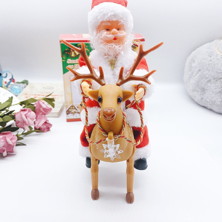 Figurine Decorative Craciun - Decoratiune Mos Craciun, Flippy, Animat, care Canta si Danseaza, cu Saculet, pe Ren, Imbracat Festiv, 28x21x10 cm, Rosu