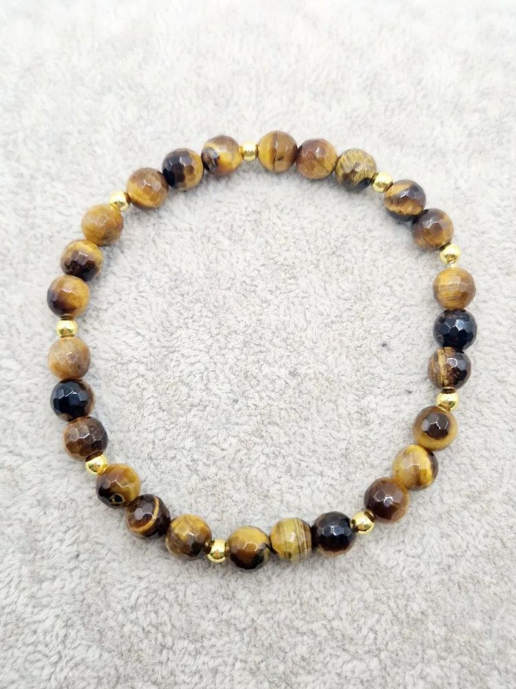 Brățară realizată pe fir elastic siliconat din Ochi de tigru de 6mm, fațetat și hematite aurii. [3]