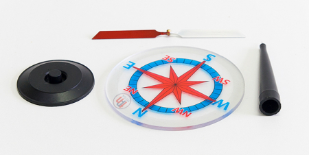 Un ac magnetic pe un suport cu o trandafir a vânturilor [1]