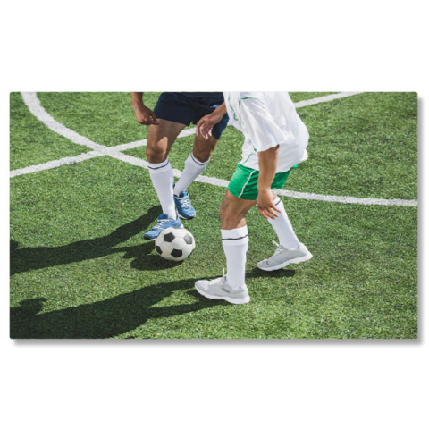 Sport - Tablou Canvas - Pasionati de Fotbal - Jocul Intens al Campionilor 40x25CM