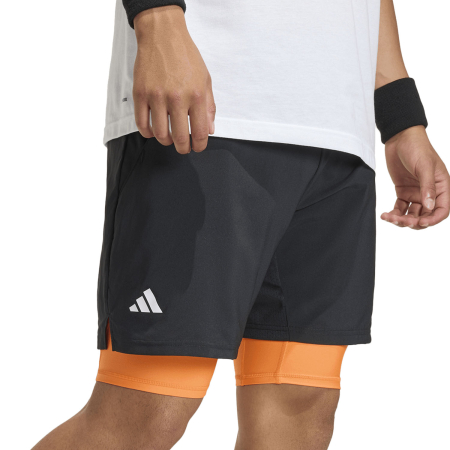 Pantaloni - Short Adidas Barbati Club 2in1 Black/Orange este un short tehnic 2 in 1 cu inner shorts integrat, CLIMACOOL, talie elastica cu snur si croiala slim fit, perfect pentru tenis si antrenamente.