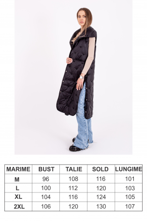 Vesta dama lungă cu capse laterale este o alegere stilată și practică pentru zilele reci. [2]