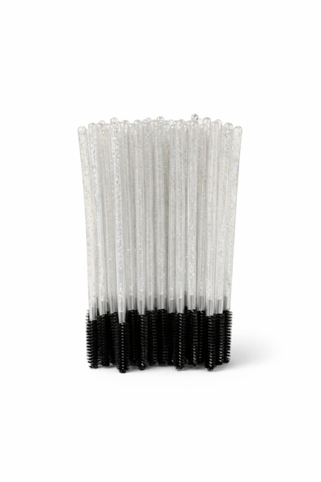 Set de periuțe colorate din silicon pentru gene, cu mâner negru și capăt flexibil în nuanțe de roz și mov, dispuse în evantai pe o suprafață albă. [3]