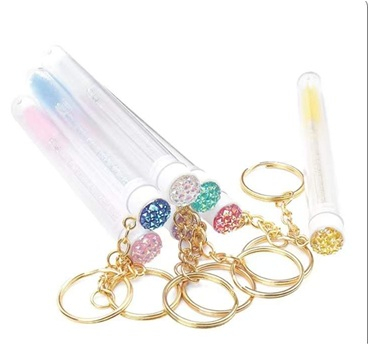 Accesori - Set de 10 periuțe tip perie de mascara pentru gene, în tuburi protectoare transparente cu breloc auriu și decorațiuni cu sclipici roz.