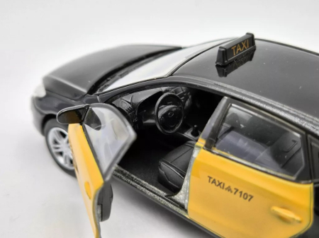 Macheta Hyundai i30 Taxi Barcelona Galben cu Negru – Welly 1:38 [2]