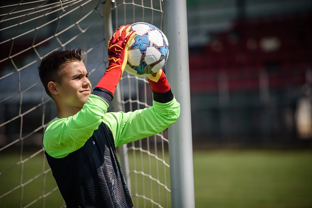 kid goalkeeper with ball