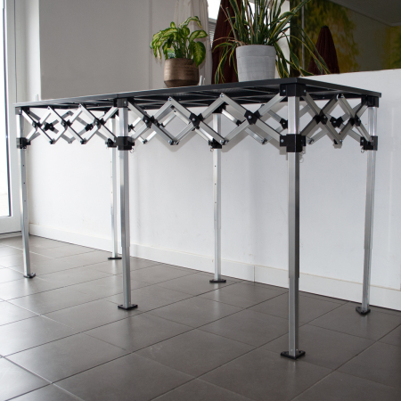 Mese si scaune pliabile - Masa - pult de prezentare pliabil - tip acordeon - inaltime reglabila 85-110 cm - aluminiu, cu blat metalic - dimensiune blat  285x70 cm - max 100Kg