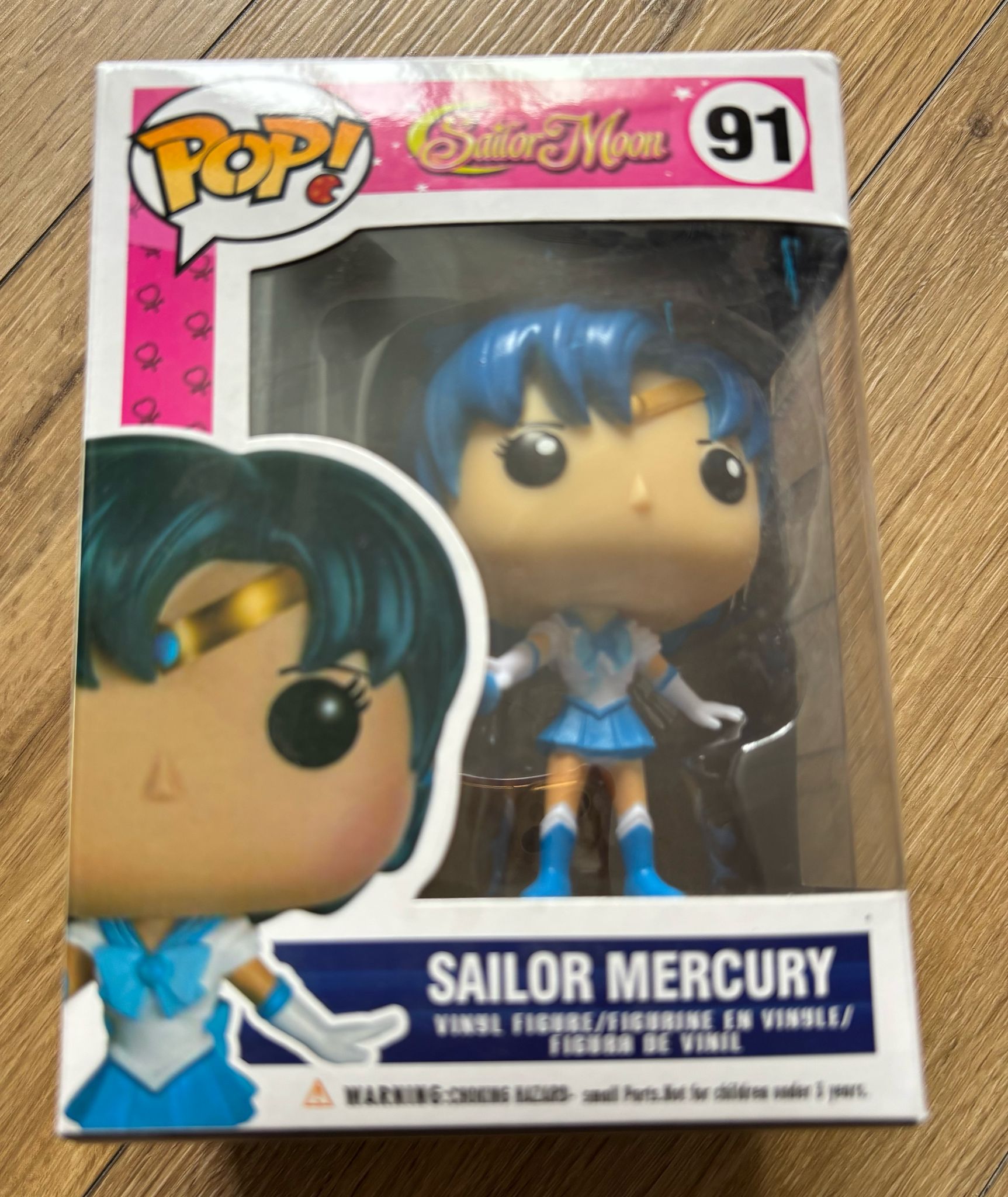 #91 – Sailor Mercury Inteligentă, analitică și mereu gata de acțiune, Sailor Mercury aduce puterea apei și gheaței în lupta pentru justiție. Costumul ei albastru și diadema aurie o fac ușor de recunos