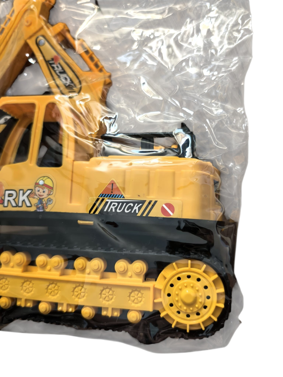 Jucărie mașină de construcții excavator galben cu șenile negre și braț articulat, ambalată în punga originală. [3]