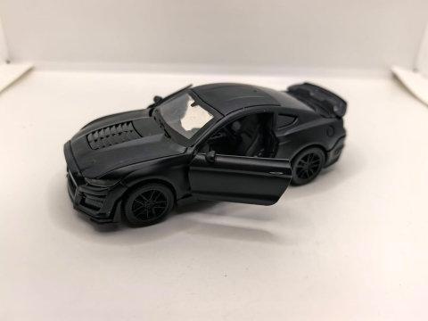 Mașini de colecție - Machetă auto metalică Maisto Ford Mustang Shelby GT500 2020 de culoare portocalie, cu ușa stângă deschisă.