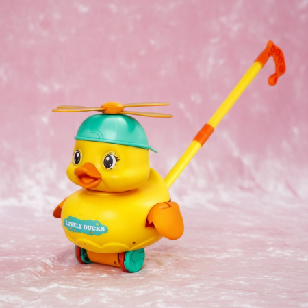 Jucării educative - Jucarie rata de impins Lovely Ducks cu elice rotativa si roti anti-alunecare pentru copii.