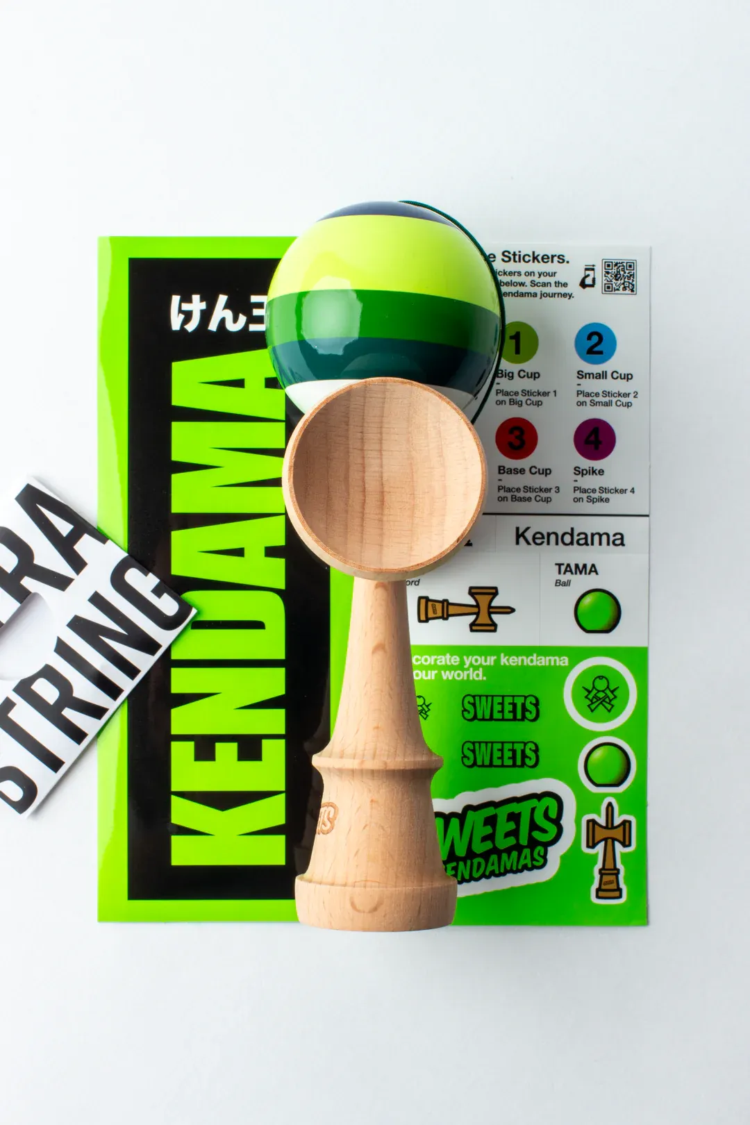 Cumpara Sweets Kendama Classic 5 Stripe Dougy Sweets <p>Pune mana pe cea mai noua kendama, marca Sweets si scoate-o la o intrecere cu ceilalti! </p><p>Noua Prime 5 stripes Dougy ne aduce un design nou si o constructie ideala pentru trick-urile balance! </p><p>Tama, vopsita in laboratoarele Sweets cu Prime Tacky, se remarca prin cele 5 dungi de nuante diferite de verde, care marcheaza gaura, pentru ca tu sa o poti urmari mai usor in miscare.</p><p>Noua Prime Dougy este o kendama formidabila pentru a porni o competitie interesanta si fascinanta, fara prea multe pregatiri.</p><p>Incearc-o si tu!</p><p>La fiecare Sweets Kendama Prime - 5 Stripes comandata, vei primi stickere, 1 manual de instructiuni, ata si margica de rezerva. </p>. Kendama originala din lemn, ideala pentru freestyle, antrenament si competitie. Potrivita pentru incepatori si avansati. [2]